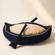 boat dog bed with matching denim paddle toys included