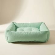 classic bolster dog bed showing tufted base and hypoallergenic fill