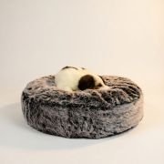small puppy sleeping in round fur dog bed cloud design