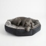 dog sleeping on fur bolster dog bed
