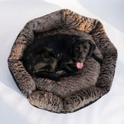 Fur Bolster Dog Bed with black dog sitting on it