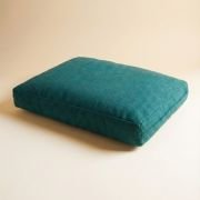 jute dog bed cover in vibrant blue and red colors