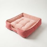 lounger dog bed with three side bolster design and open front entrance