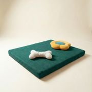 chew toys on orthopedic dog bed