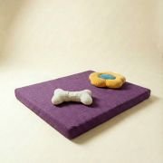 chew toys on orthopedic dog bed