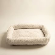 dog crate mat showing padded bolster cushion around perimeter